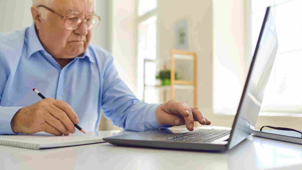 An older man doing his Incapacity Planning on a computer